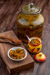 Homemade raw mango pickle, mango pickle is a traditional Indian condiment made with raw mangoes, spices and oil.