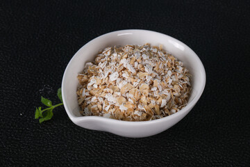Raw oats in the bowl