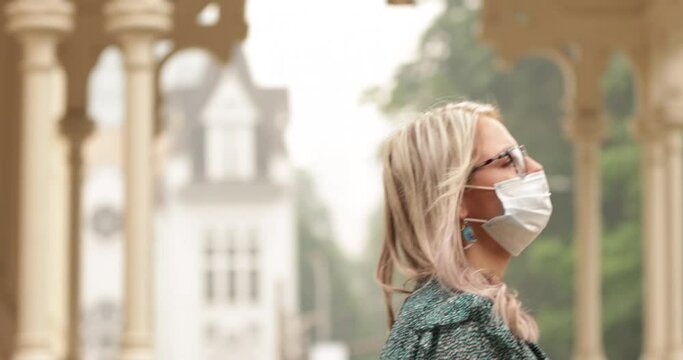 Closeup, Slow motion, Young, Beautiful Girl with Blonde Hair, in Glasses, wearing mask, walking in Downtown Portland, Pandemic, 2020