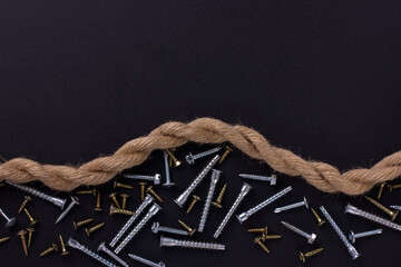 furniture screws, self-tapping screws, rope on a black foil with a place for text