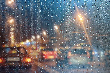 rain urban traffic cars, night view of the city, traffic flow of city lights abstract autumn background