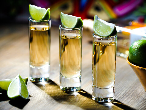 Three Shots Of Tequila In Tall Shot Glasses