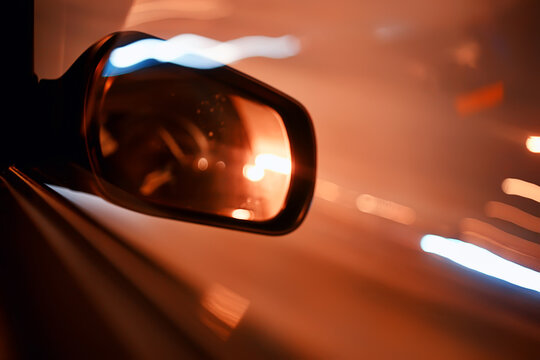 night trip on car background, abstract blurred rear view mirror urban road