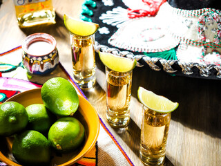 Three shots of tequila in tall shot glasses