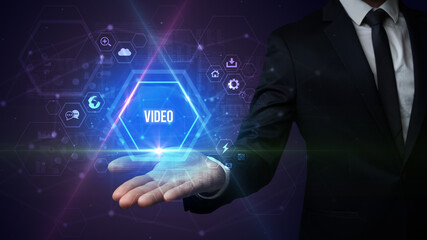 Man hand holding VIDEO inscription, social media concept