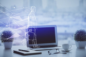 Desktop computer background in office and start up theme hologram drawing. Double exposure. Startup concept.