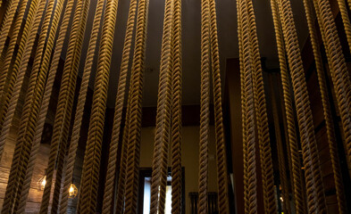 selective focus shot of brown ropes inside a building