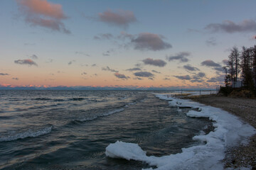 Sayan mountains in the fog on lake Baikal.