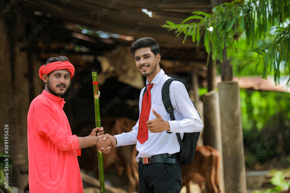 Wall mural indian farmer and banker or agronomist shake hand at home