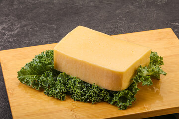 Tasty yelloow Tilsiter cheese brick