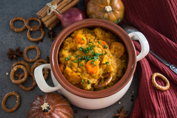 Winter dinner on a table. Fresh made squash stew with lentils and carrots. Healthy eating concept. 