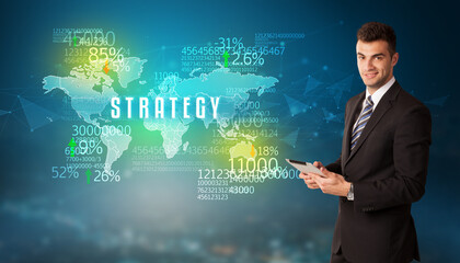 Businessman in front of a decision with STRATEGY inscription, business concept