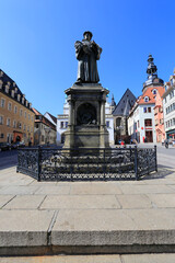 Fototapeta na wymiar Denkmal von Martin Luther in Eisleben. Sachsen-Anhalt, Deutschland, Europa -- Monument of Martin Luther in Eisleben. Saxony-Anhalt, Germany, Europe
