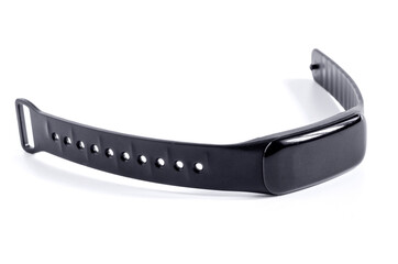 black fitness bracelet in a plastic case close-up on a white background