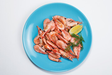 Shrimp with lemon top view on a light background