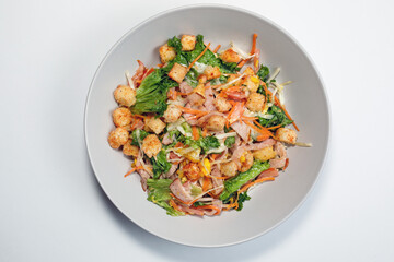 Salad top view on light background