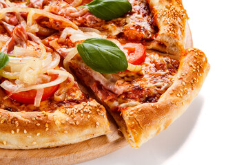 Pizza with ham, mozzarella, champignon, tomatoes and onion on white background
