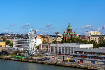 Helsinki city center shot from the sea. Embankment, The Uspenski Cathedral, Ferris wheel. Classic view of the center of Helsinki in a sunny weather.