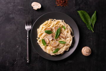 Italian pasta with creamy sauce and mushrooms