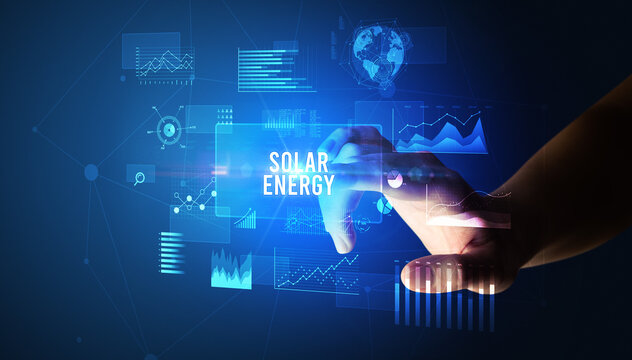Hand touching SOLAR ENERGY inscription, new business technology concept