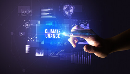 Hand touching CLIMATE CHANGE inscription, new business technology concept