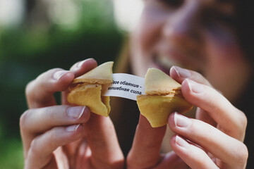 fortune cookie in hand