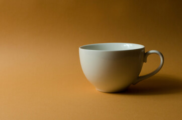 Cup and teapot on the table