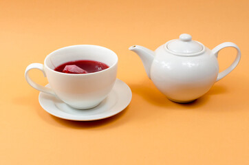 Cup and teapot on the table