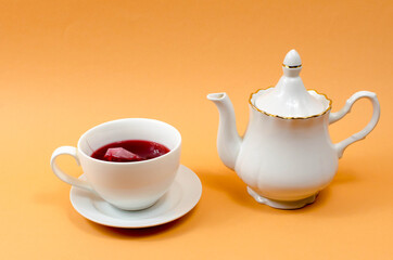 Cup and teapot on the table