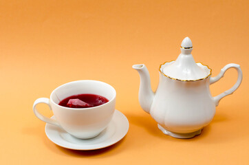 Cup and teapot on the table
