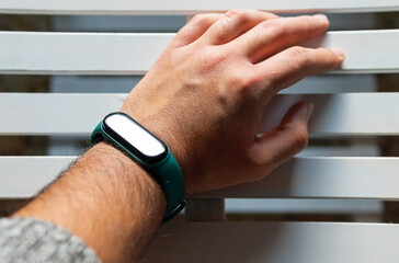 Hand with a modern smart watch on a white background. Isolated. Smart watch.