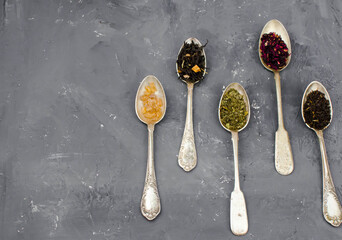 spoon with tea on the table