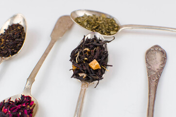 spoon with tea on the table