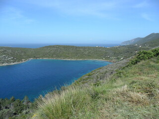 Fototapeta na wymiar The tuquoise water, paradise beaches and mountains on the greek island of Samos in the Aegean Sea, Greece