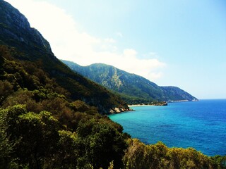 Fototapeta na wymiar The turquoise ocean and paradise beaches of the greek island of Samos in the Aegean Sea, Greece