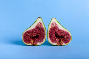 Fresh fig fruit on blue background.