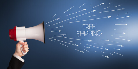 Young girl screaming to megaphone with FREE SHIPPING inscription, shopping concept