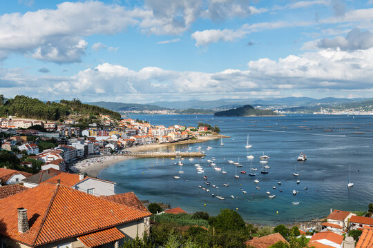 Aerial view of a typical Galician village (Raxo) in the Ria de Pontevedra on a cloudy Summer morning.