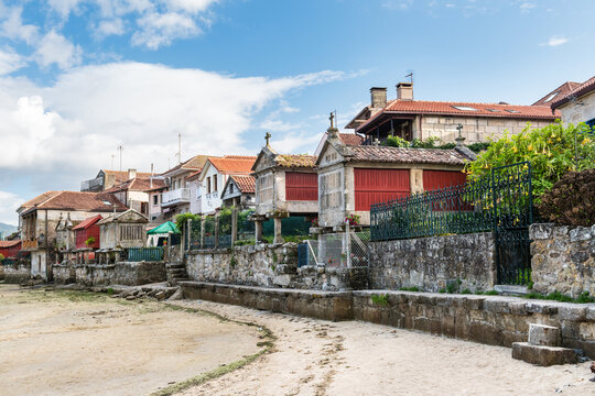 Low tide at the well-preserved village of Combarro in Ponteveda, Spain, famous for its stone cruceiros (calvaries) and horreos (raised granaries).
