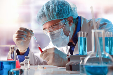 Researcher in laboratory mixing reagent with sample in laboratory
