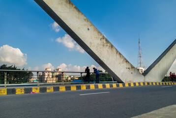 Obraz premium People are passing time in the city besides beautiful architectural street