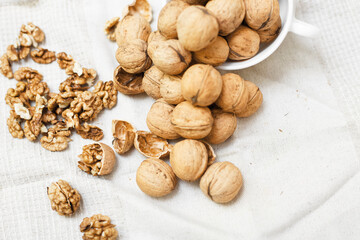 walnuts on a white wooden background