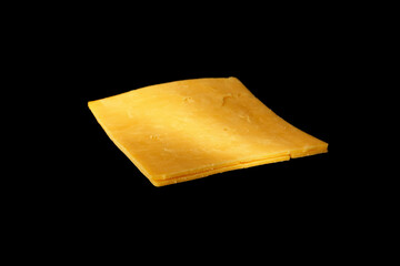 Slice of cheddar cheese isolated on black background flying prepared ingredient.