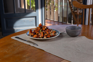 sautéed sweet potato dish with vegetables and chickpeas