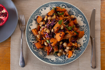 sautéed sweet potato dish with vegetables and chickpeas