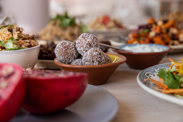 
full table healthy Indian, Asian and Mediterranean dishes with white beans, lentils, sweet potatoes, rice and vegetables