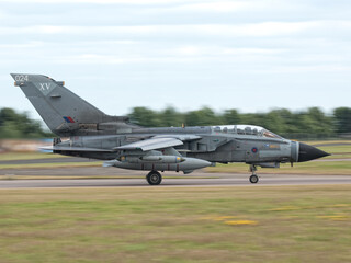 Fototapeta na wymiar An RAF Tornado GR.4 fires up its afterburners and takes off at an airshow to start its display.