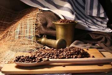 Spoon of wood with coffee inside and pusher for beverage preparation