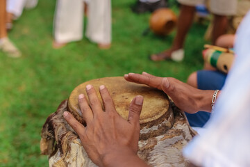 Popular Culture of Capoeira - Hands of man playing African percussive drum