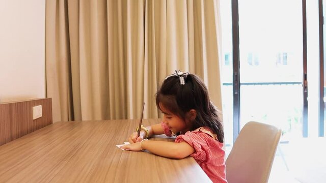 Cute Little Girl Is Drawing Picture